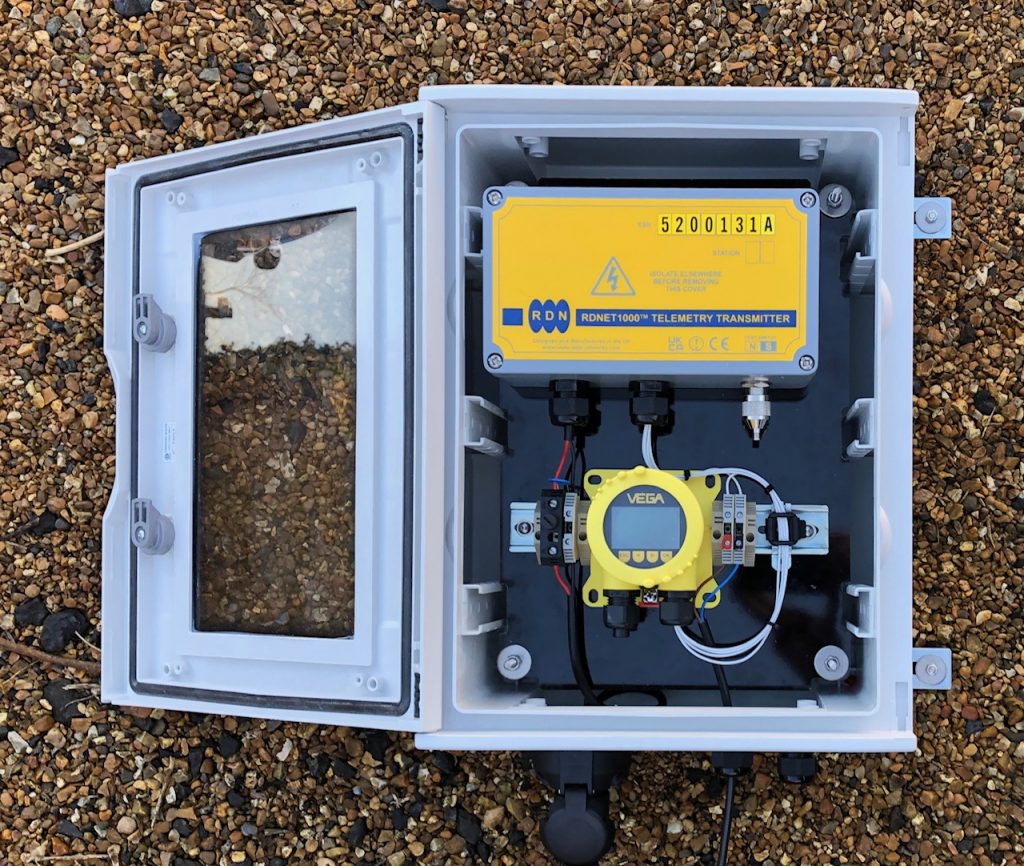 Radio telemetry system complete with level display to convey a sludge tank level over a distance of 3km